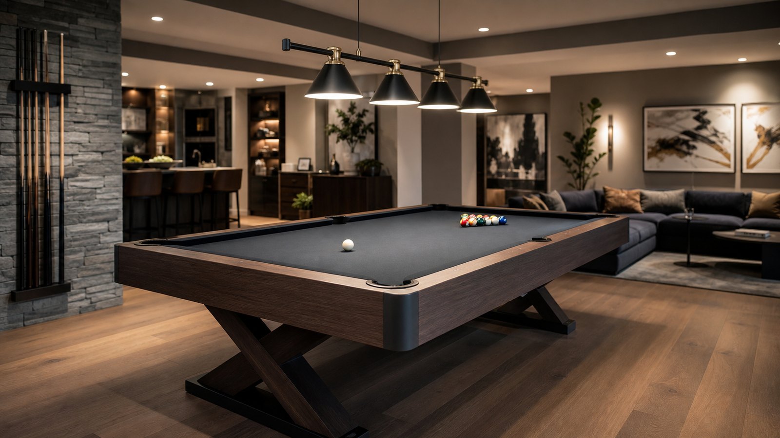 Pool table in a finished game room with seating set back from the play area